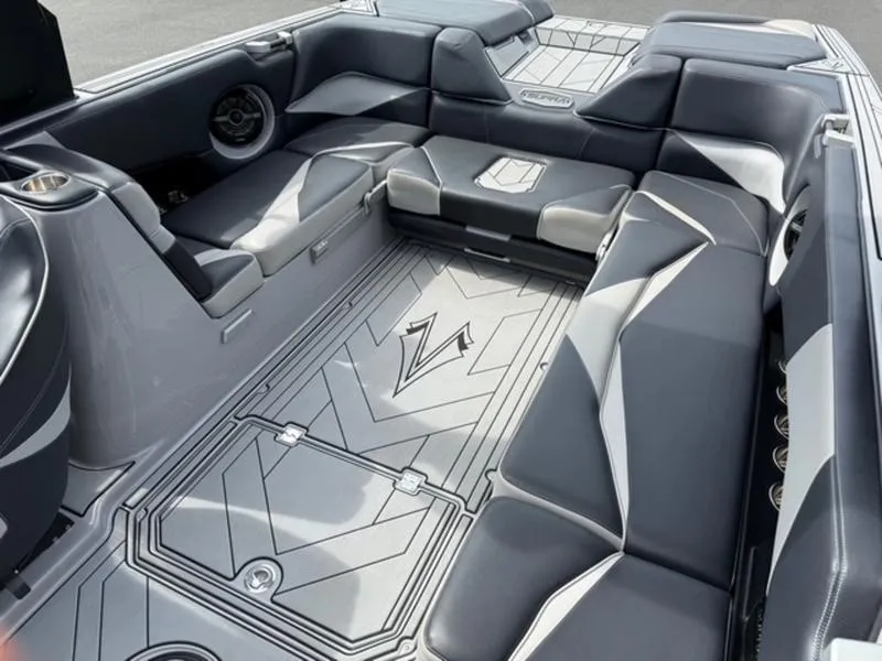 Slide: The Image of 2020 Supra SL450 boat interior with sleek gray seating and modern design. - 1