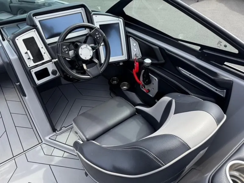 Slide: The Image of 2020 Supra SL450 boat interior with modern dashboard and steering wheel. - 11