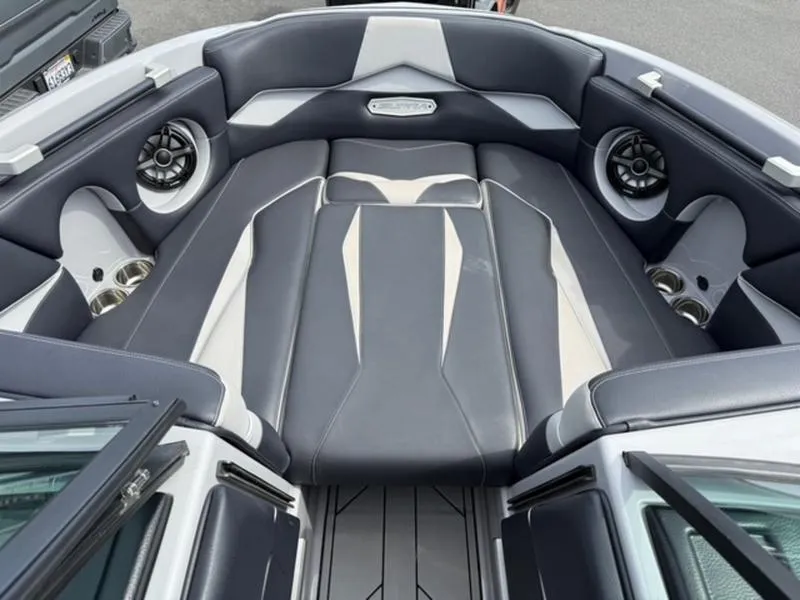Slide: The Image of 2020 Supra SL450 boat interior with sleek gray and white seating, premium speakers, and cup holders. - 13