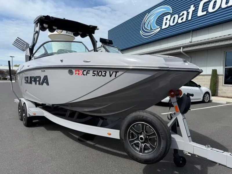 Slide: The Image of 2020 Supra SL450 boat on trailer outside Boat Country dealership. - 3
