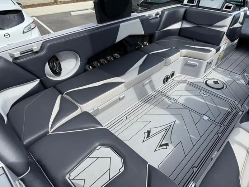 Slide: The Image of Interior of a 2020 Supra SL450 boat with sleek seating and modern design. - 9