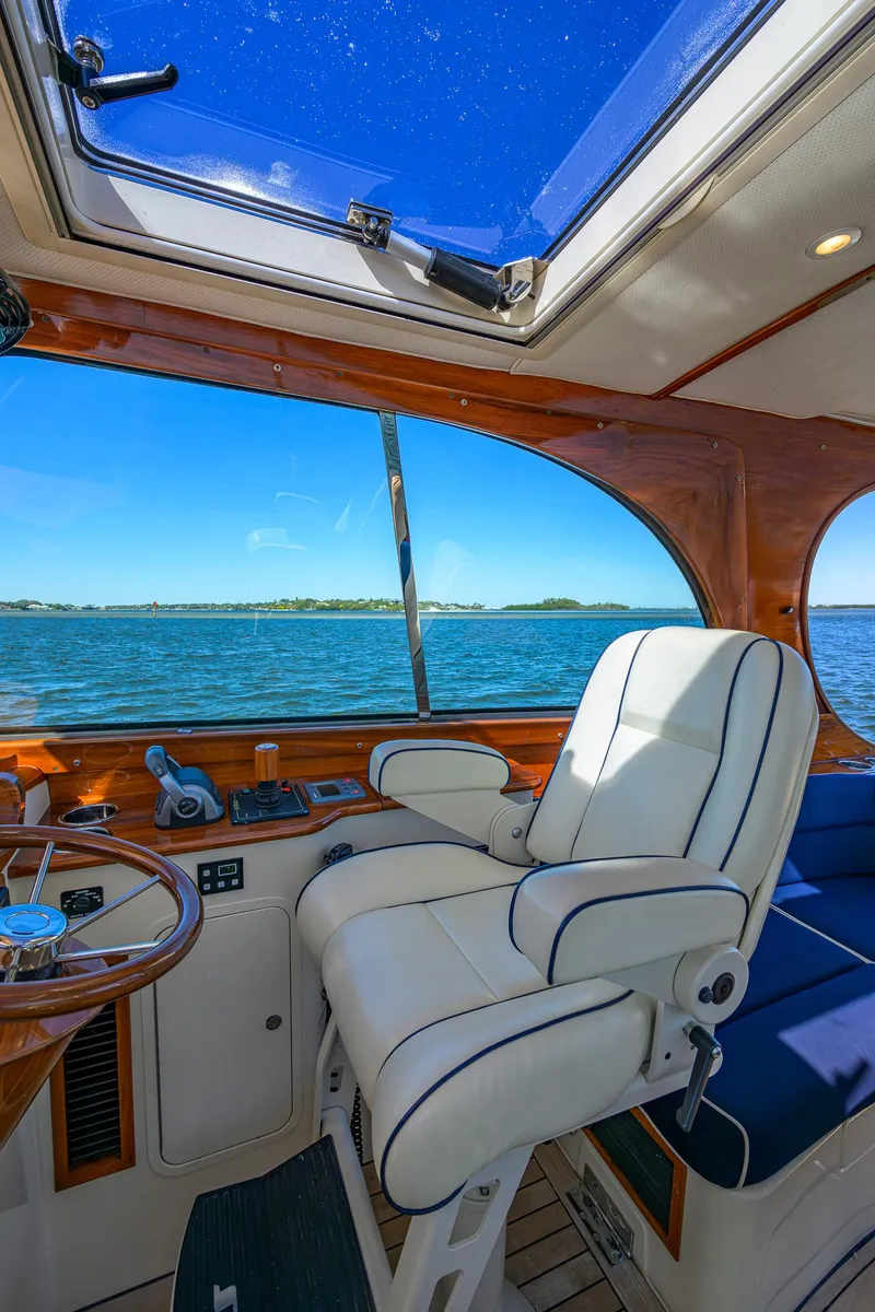 Slide: The Image of Interior of 2010 Hinckley Picnic Boat 37 MKIII with ocean view through large windows. - 14