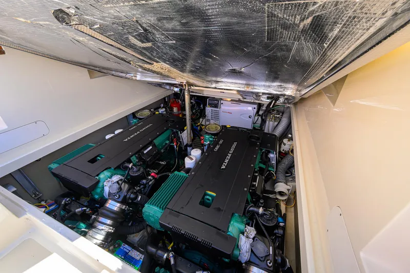 Slide: The Image of Engine compartment of 2010 Hinckley Picnic Boat 37 MKIII, featuring dual engines and mechanical components. - 30