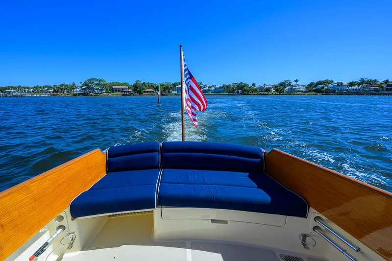 Slide: The Image of Hinckley Picnic Boat 37 MKIII, 2010, cruising on a sunny day with American flag. - 7