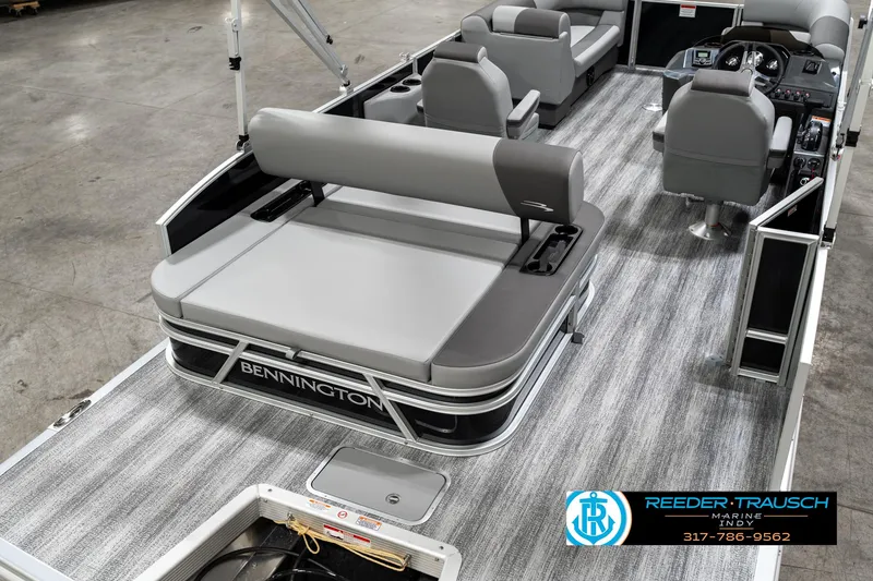 Slide: The Image of 2025 Bennington 21 SSB pontoon boat with gray seating and modern interior design. - 11