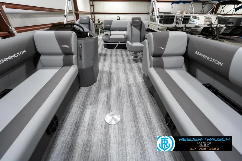 Slide: The Image of 2025 Bennington 21 SSB pontoon boat interior with gray seating and modern design. - 13