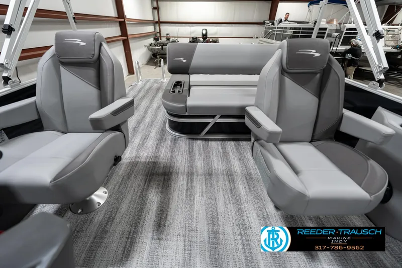 Slide: The Image of 2025 Bennington 21 SSB boat interior with gray seating and carpeted floor. - 14