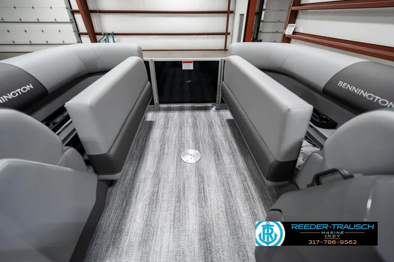 Slide: The Image of 2025 Bennington 21 SSB pontoon boat interior with gray seating and flooring. - 19