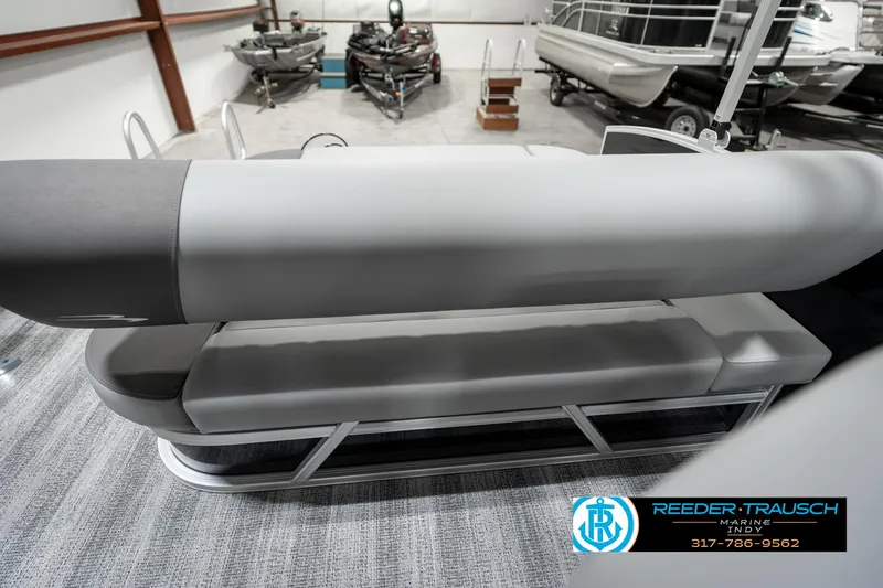 Slide: The Image of 2025 Bennington 21 SSB pontoon boat interior with gray seating in showroom. - 24