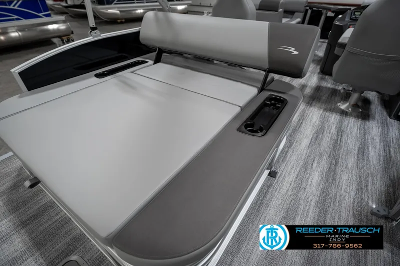 Slide: The Image of 2025 Bennington 21 SSB boat interior with gray seating and cup holders. - 26