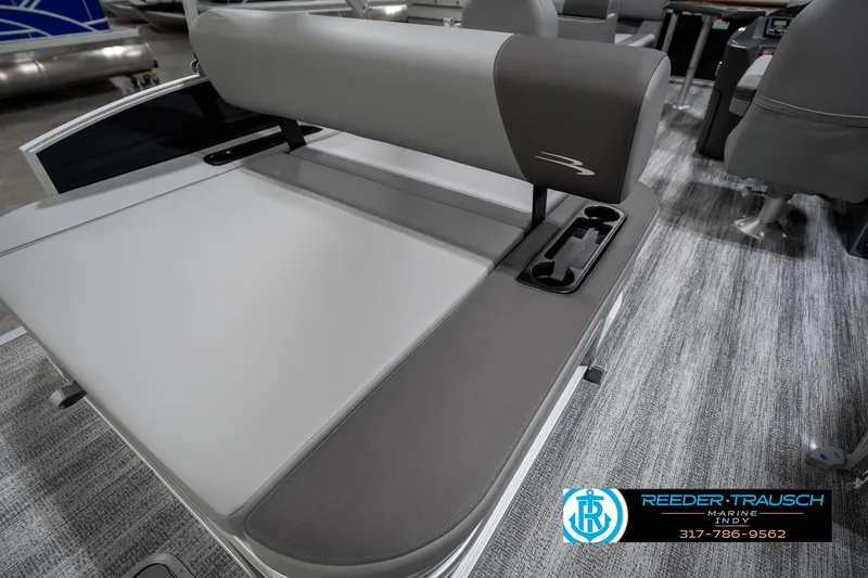 Slide: The Image of 2025 Bennington 21 SSB boat interior with gray seating and cup holders. - 27