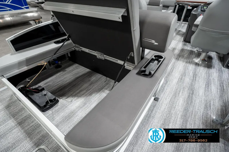 Slide: The Image of 2025 Bennington 21 SSB boat interior with open storage compartment and seating. - 28