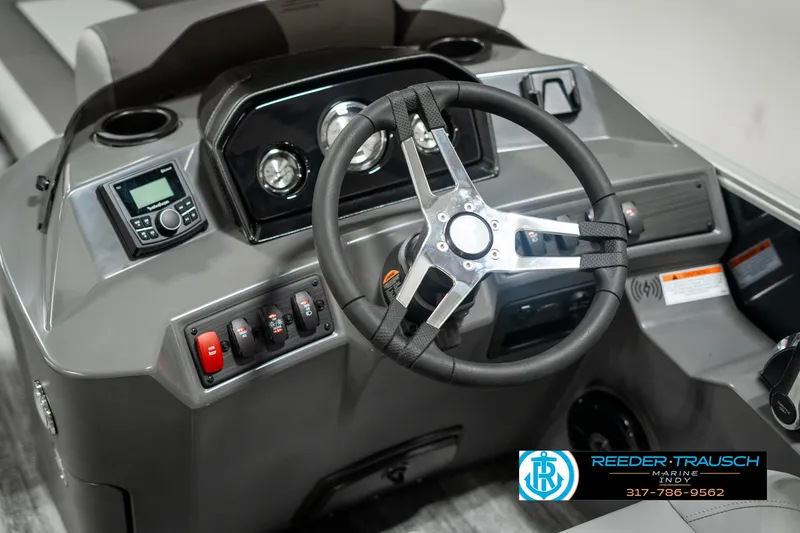 Slide: The Image of 2025 Bennington 21 SSB boat dashboard with steering wheel and control panel. - 30