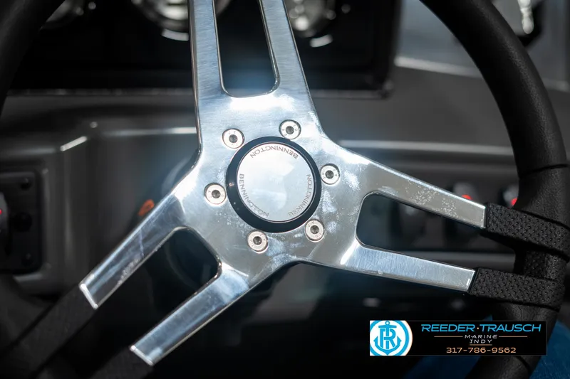 Slide: The Image of Steering wheel of 2025 Bennington 21 SSB boat, featuring sleek metallic design. - 31