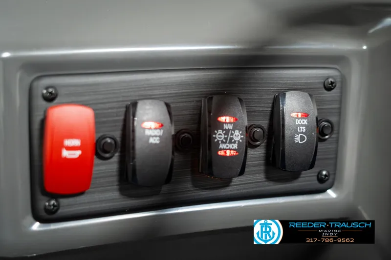 Slide: The Image of Control panel of 2025 Bennington 21 SSB boat with labeled switches. - 32