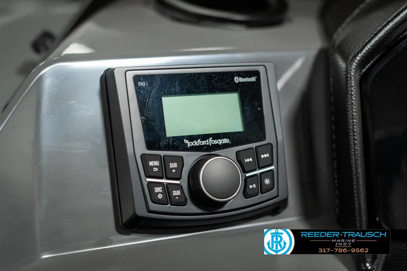 Slide: The Image of Rockford Fosgate Bluetooth stereo system on 2025 Bennington 21 SSB boat dashboard. - 33