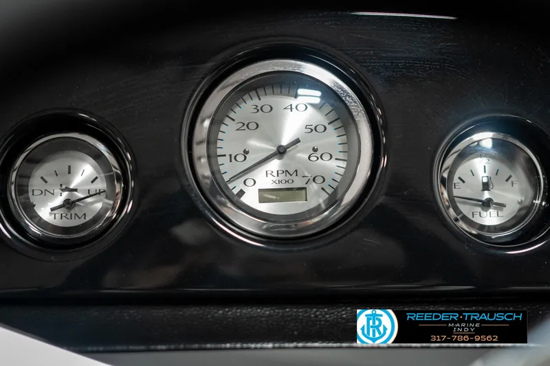 Slide: The Image of Dashboard gauges of a 2025 Bennington 21 SSB boat, featuring RPM, trim, and fuel indicators. - 34