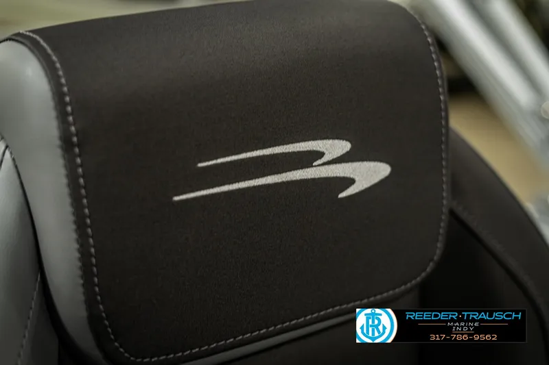 Slide: The Image of 2025 Bennington 21 SSB boat seat with logo, featuring sleek black upholstery. - 43