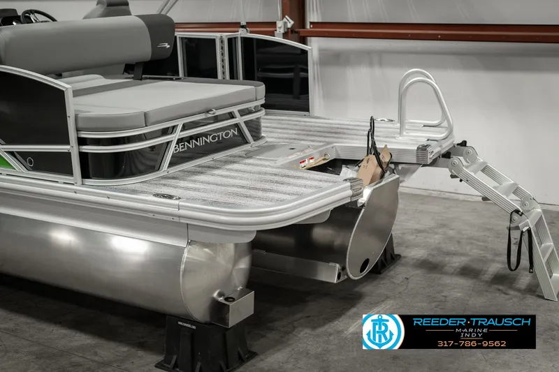 Slide: The Image of 2025 Bennington 21 SSB pontoon boat with sleek design in showroom setting. - 46