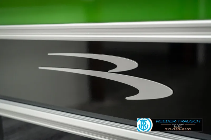 Slide: The Image of 2025 Bennington 21 SSB boat logo with sleek design and Reeder-Trausch branding. - 47