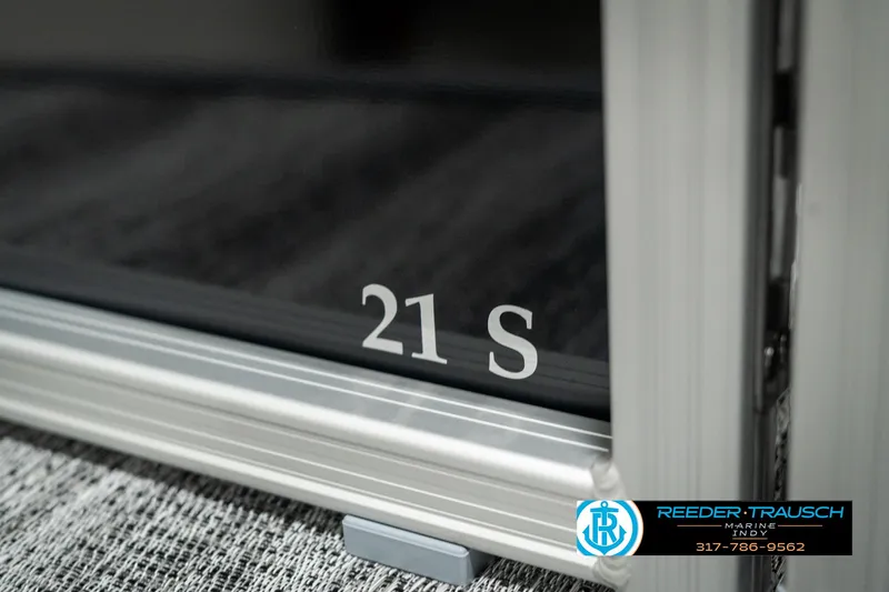 Slide: The Image of 2025 Bennington 21 SSB boat detail with Reeder-Trausch logo and contact information. - 48