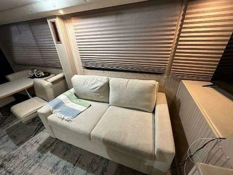 Slide: The Image of Interior of 2004 Gibson 50 Houseboat with beige sofa and striped blinds. - 8