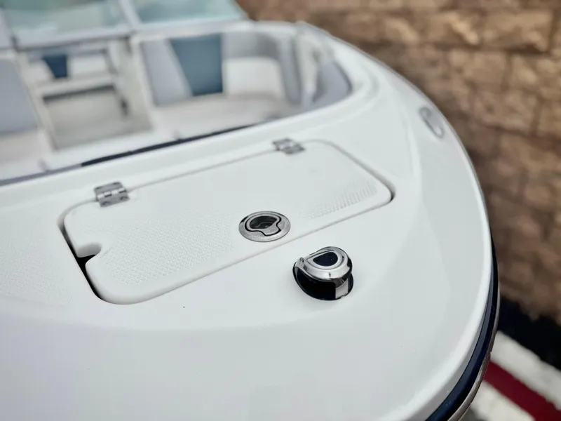 Slide: The Image of 2021 Chaparral 21 SSi boat bow with storage compartment and sleek design. - 10