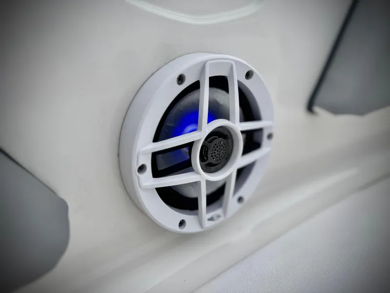 Slide: The Image of Speaker on 2021 Chaparral 21 SSi boat, featuring blue LED lighting. - 15