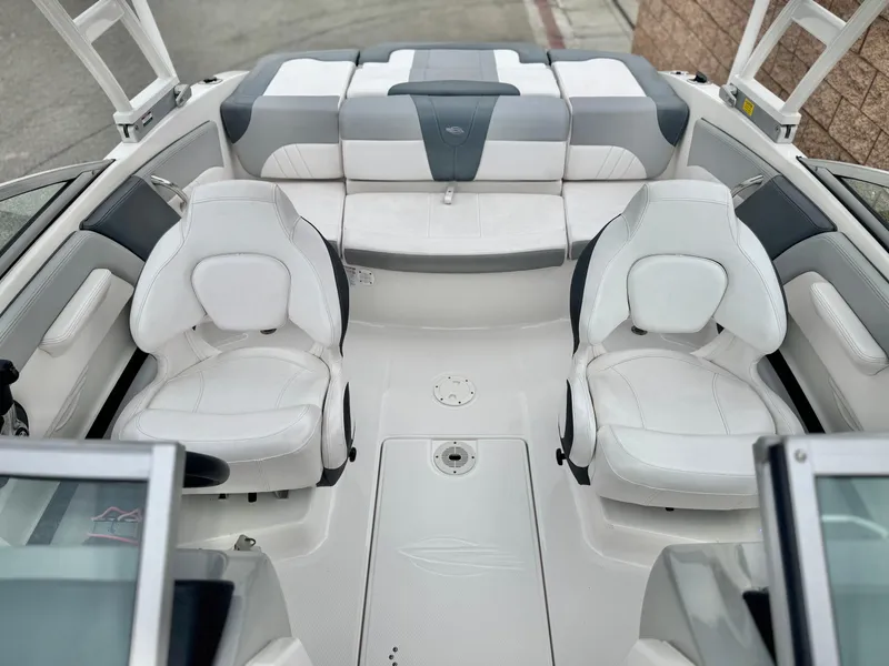 Slide: The Image of 2021 Chaparral 21 SSi boat interior with white seating and modern design. - 17