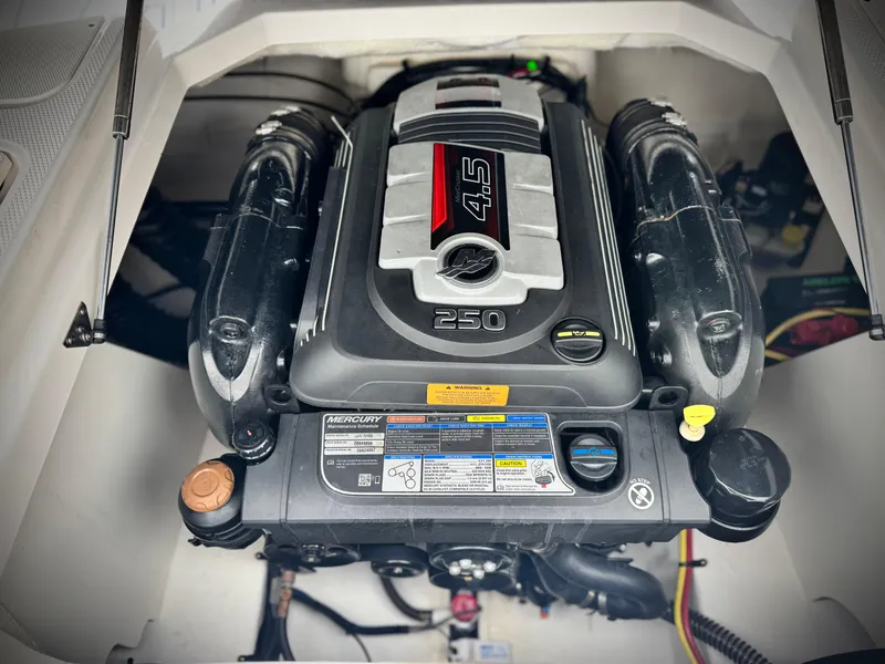 Slide: The Image of 2021 Chaparral 21 SSi engine compartment featuring a powerful Mercury 4.5L 250 HP engine. - 20