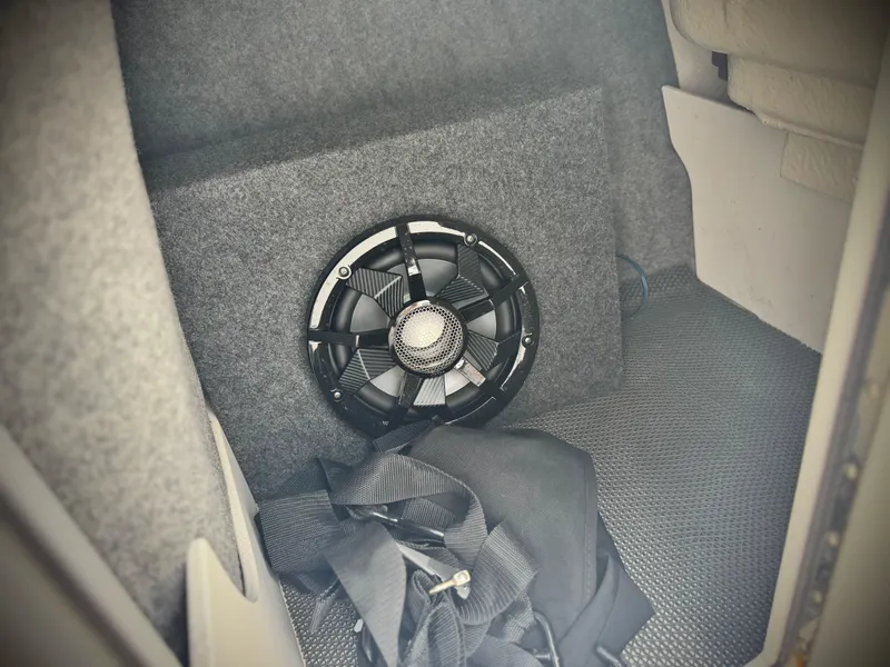 Slide: The Image of Speaker installed in a 2021 Chaparral 21 SSi boat interior compartment. - 24