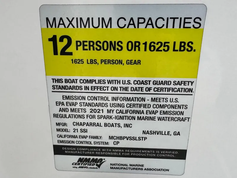 Slide: The Image of 2021 Chaparral 21 SSi capacity label: 12 persons or 1625 lbs, U.S. Coast Guard compliant. - 32