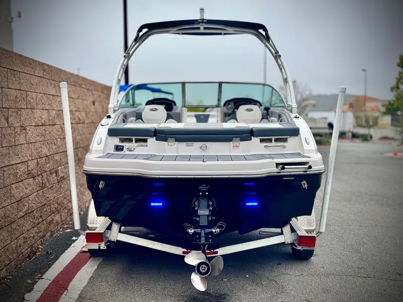 Slide: The Image of 2021 Chaparral 21 SSi boat on trailer, rear view with blue lights. - 4