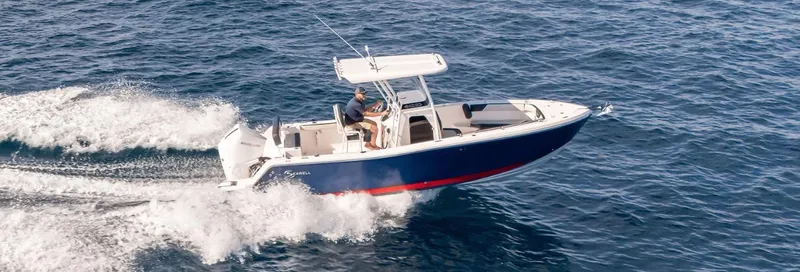 Slide: The Image of 2024 SeaWell 240CC boat cruising on open water, showcasing sleek design and performance. - 2