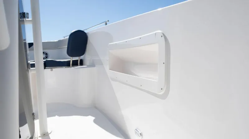 Slide: The Image of 2024 SeaWell 240CC boat interior with white seating and storage compartment. - 30