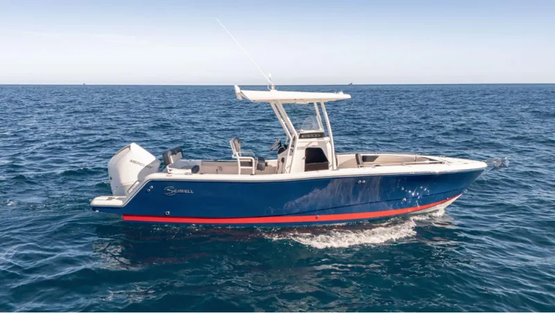 Slide: The Image of 2024 SeaWell 240CC boat cruising on open ocean waters. - 34