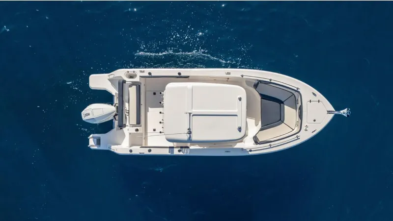 Slide: The Image of Overhead view of a 2024 SeaWell 240CC boat on deep blue water. - 37