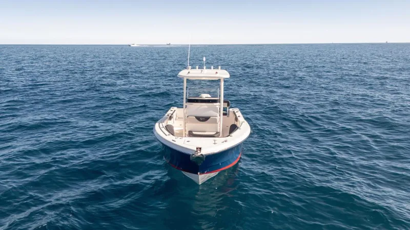 Slide: The Image of 2024 SeaWell 240CC boat on open ocean, clear sky, calm waters. - 41
