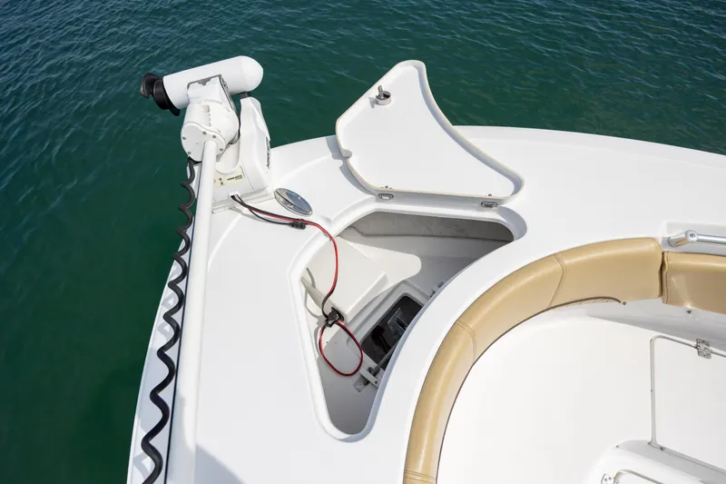 Slide: The Image of 2021 Sportsman Heritage 231 Center Console boat with open storage compartment and trolling motor. - 26