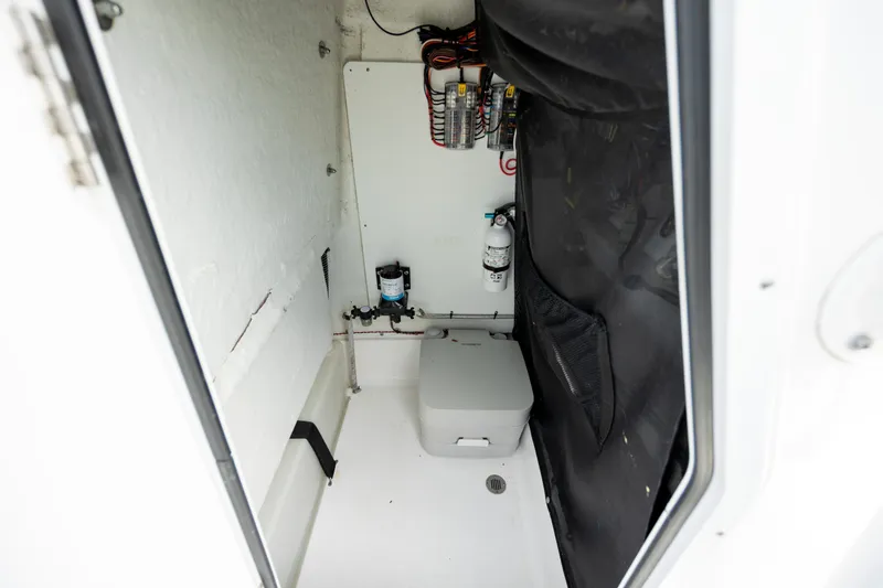 Slide: The Image of 2021 Sportsman Heritage 231 Center Console storage compartment interior. - 27