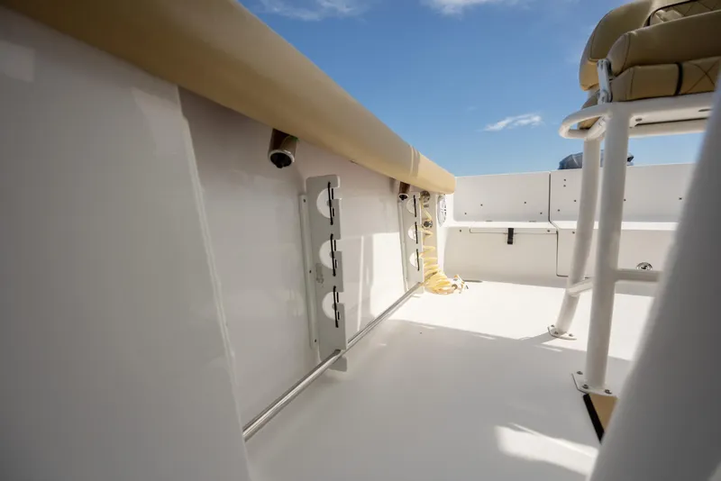 Slide: The Image of 2021 Sportsman Heritage 231 Center Console interior with seating and rod holders. - 28