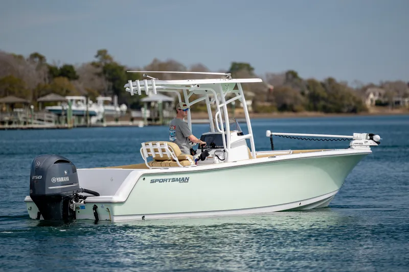 Slide: The Image of 2021 Sportsman Heritage 231 Center Console boat on calm water. - 6