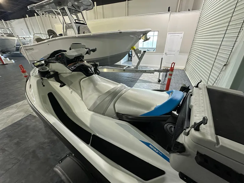 Slide: The Image of 2022 Sea-Doo Fish Pro Scout jet ski displayed indoors, showcasing sleek design and fishing features. - 4