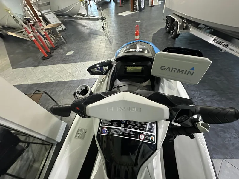 Slide: The Image of 2022 Sea-Doo Fish Pro Scout with Garmin navigation system, displayed indoors. - 6