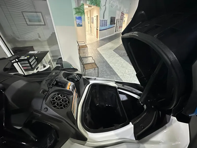 Slide: The Image of 2022 Sea-Doo Fish Pro Scout with open storage compartment in showroom. - 7