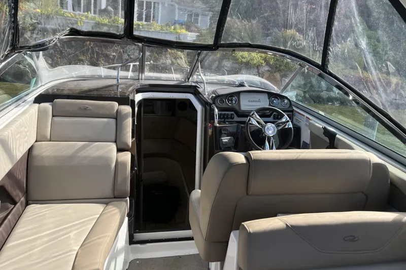 Slide: The Image of 2014 Regal 28 Express boat interior with seating and steering wheel. - 5