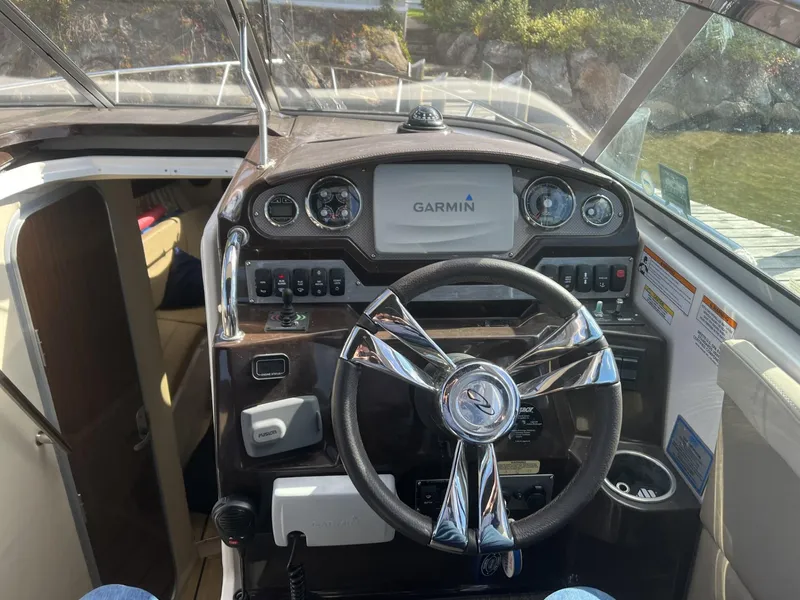 Slide: The Image of 2014 Regal 28 Express boat dashboard with Garmin navigation system. - 8