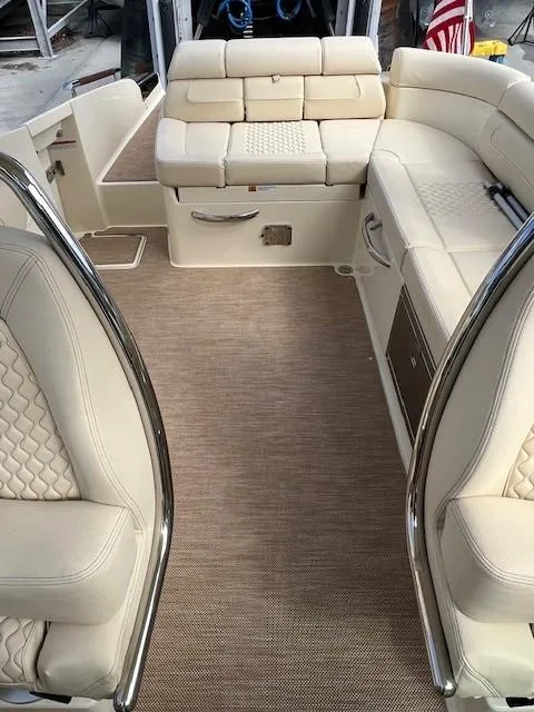Slide: The Image of 2022 Chris-Craft Launch 28 GT interior with beige seating and elegant design. - 10