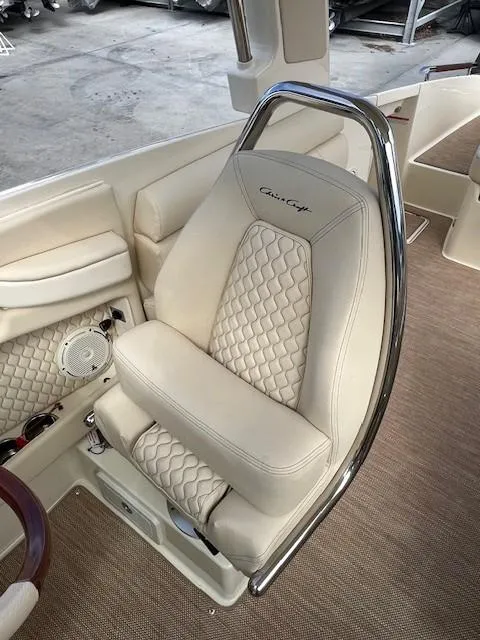 Slide: The Image of 2022 Chris-Craft Launch 28 GT boat seat with quilted upholstery and chrome accents. - 12