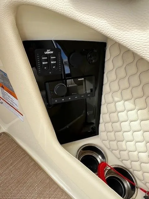 Slide: The Image of 2022 Chris-Craft Launch 28 GT control panel with quilted interior and cup holders. - 17